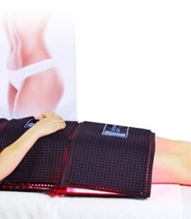 A patient lying comfortably on a treatment table with the full body Contour Light professional red light therapy machine